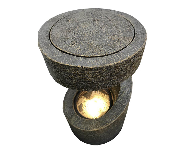 A fountain viewed from bird's eys has LED light on.